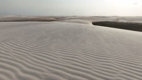 flying above desert sand dunes of lencois maranhenses national park in maranhao, brazil. drone shot