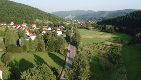 Aerial-Shot-of-Long-Fire-Truck-Convoy-at-Long-Straight-Road-in-Sunny-Day-4k