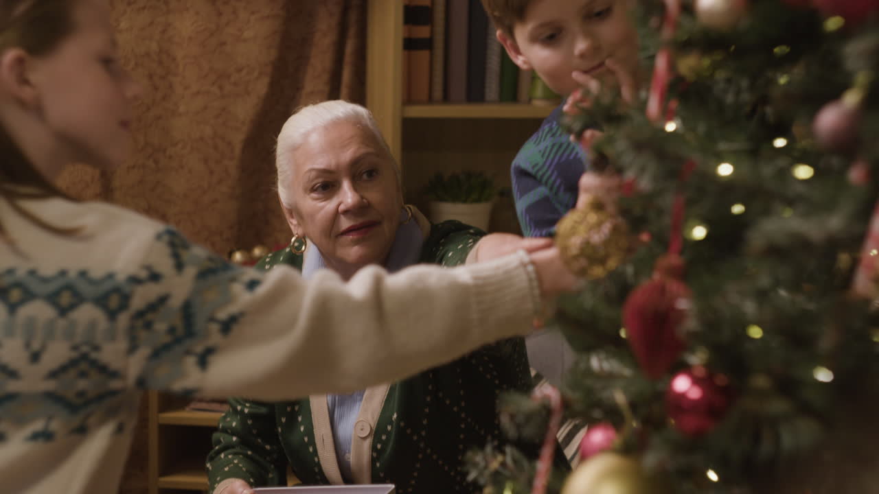 Family decorating Christmas tree
