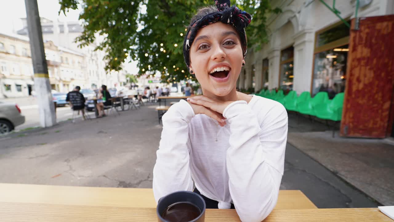 Young Woman at an Outdoor Cafe
