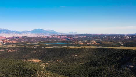 View-of-Utah-National-Park-red-canyons-and-Lake-Powell-high-angle-aerial-overlook-with-mountains-in-background