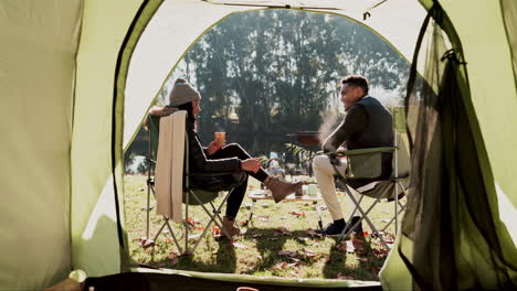 couple, camping and back with tent