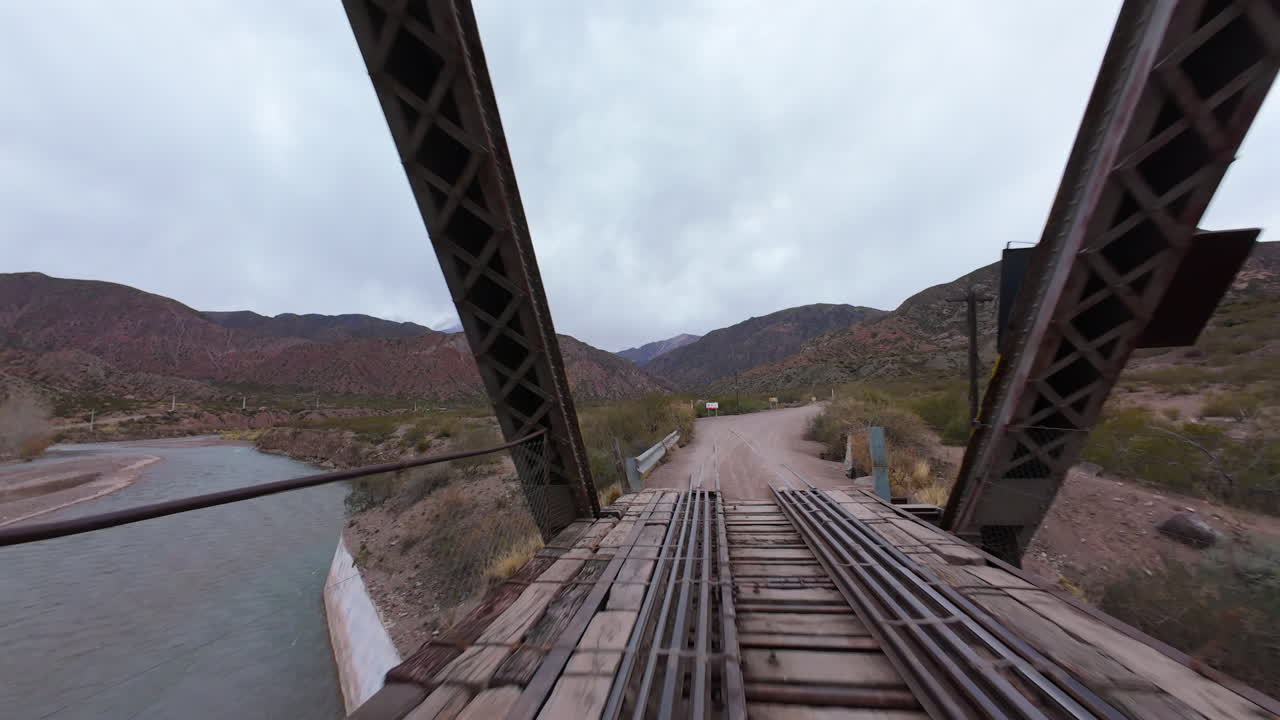 FPV Fly Through Steel Railway Bridge in Andes Mountains Landscape Mendoza Argentina