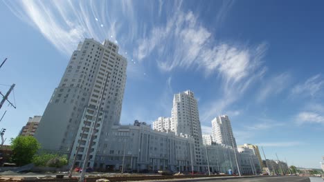 modern apartment buildings under construction in a cityscape