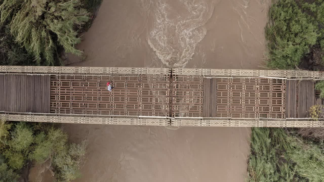 Wooden Bridge Over a Flooded River