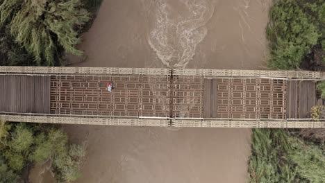 wooden bridge over a flooded river