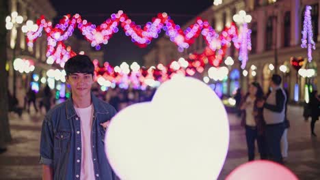 young man with flowers on a romantic night