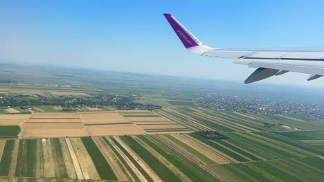 plane window view takeoff suceava airport in romania, fly airplane wing view