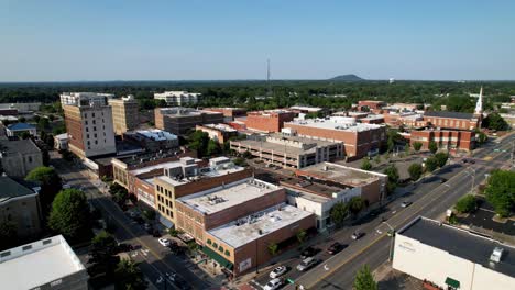 High-Aerial-Pullout-Gastonia-NC,-Gastonia-North-Carolina-high-over-church-steeple