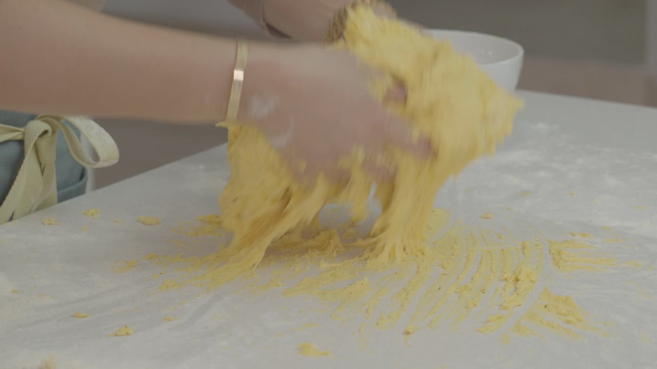 The chef kneads the bread dough to make it smooth