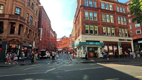 busy street with people and lanterns