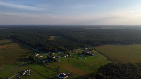 an aerial view, high up over vast farmlands in delaware on a sunny day