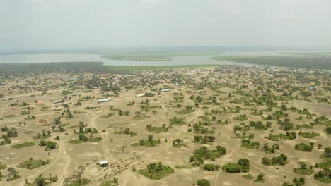 Ugandan-wild-land-with-trees-dotted-on-the-landscape-with-rivers-and-buildings