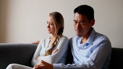 man comforting upset woman