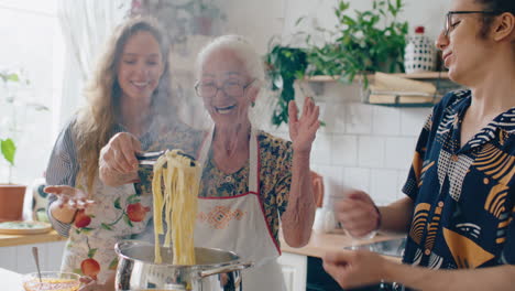 happy elderly woman and grandchildren cooking homemade pasta together