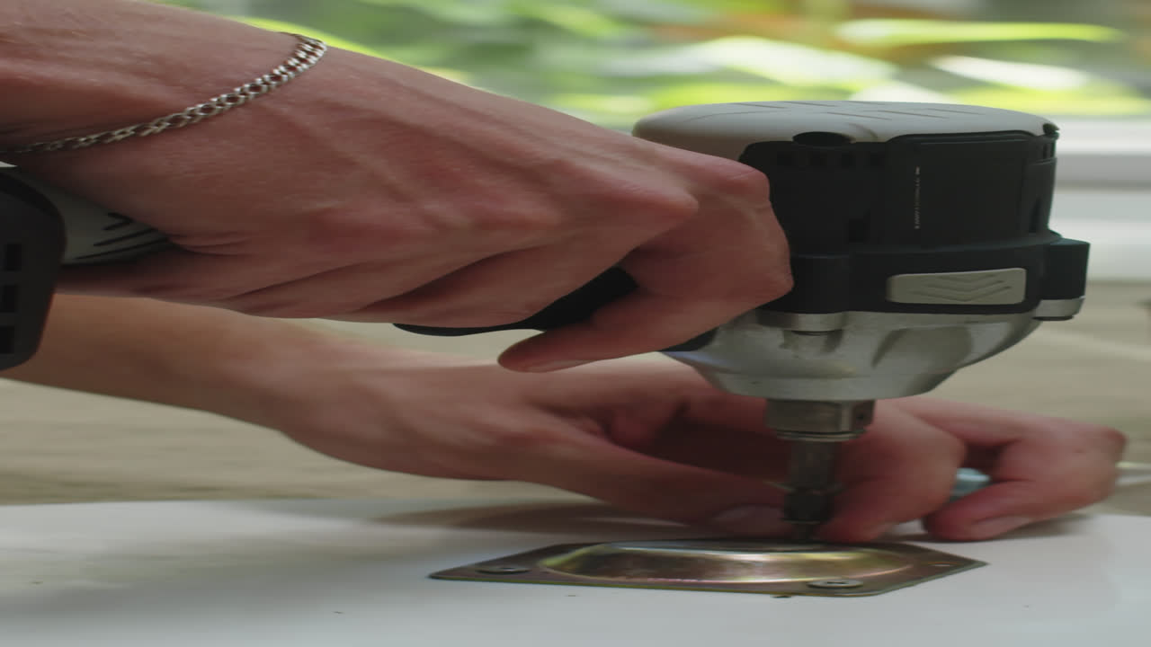 Vertical of Man Drilling Metal Fittings