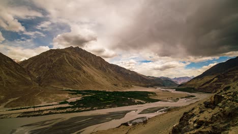 Storm-clouds-and-moving-light-over-Nubra-Valley,-Ladakh