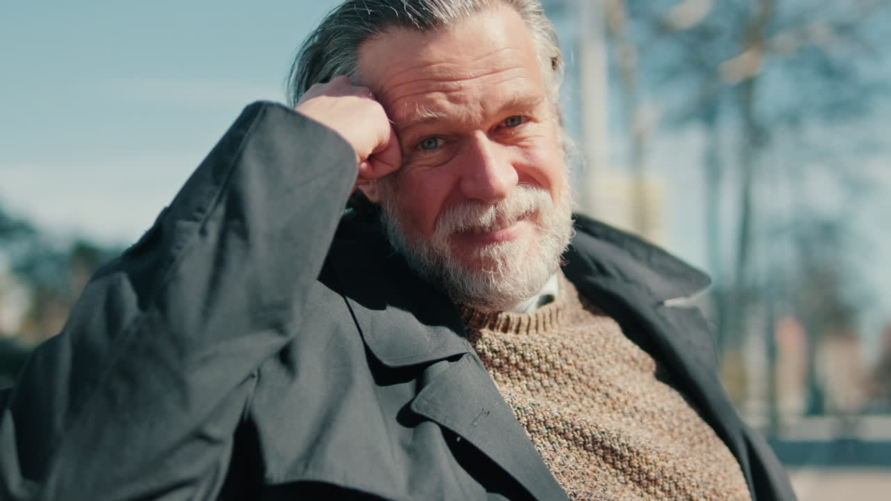 Thoughtful Senior Man Sitting in a Park