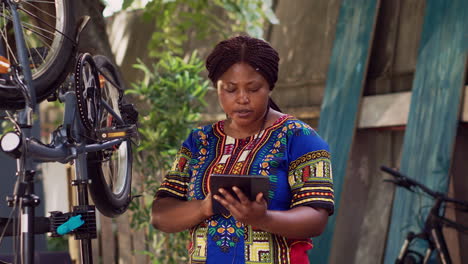 bicycle maintainance with phone tablet