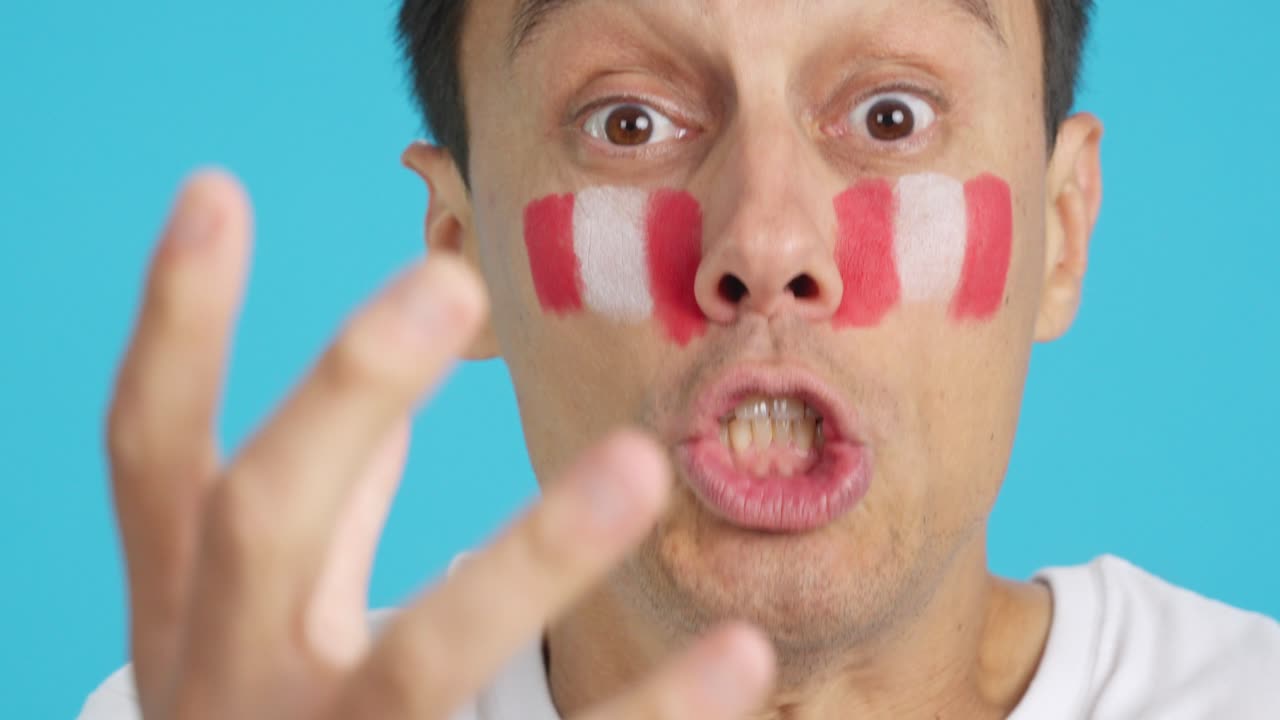 Very nervous man supporting peruvian team during a difficult match
