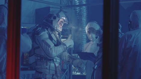 astronauts in space suit training