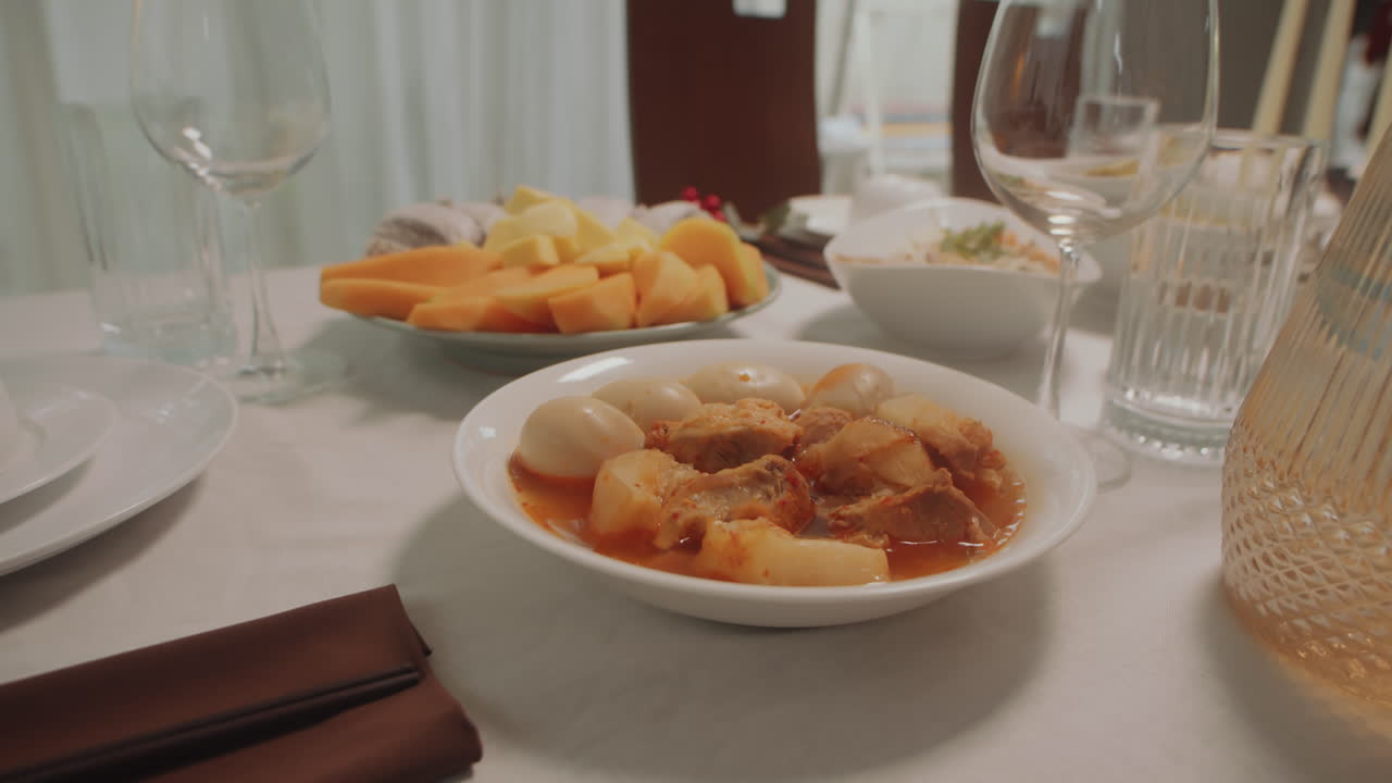 Main Course and Fruit Plate on Dinner Table
