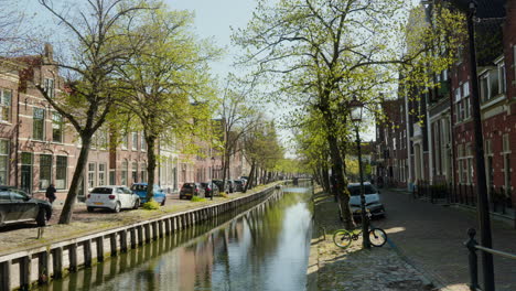 edam: sunlit canals and historic buildings in the netherlands