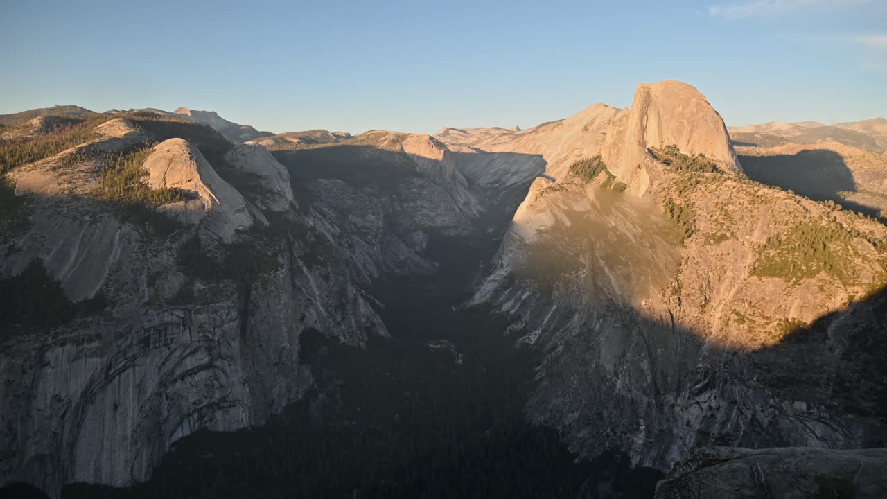 A Timelapse of the sun moving up the mountains as the sun starts to set at the famous Glacier Point in Yosemite National Park In California