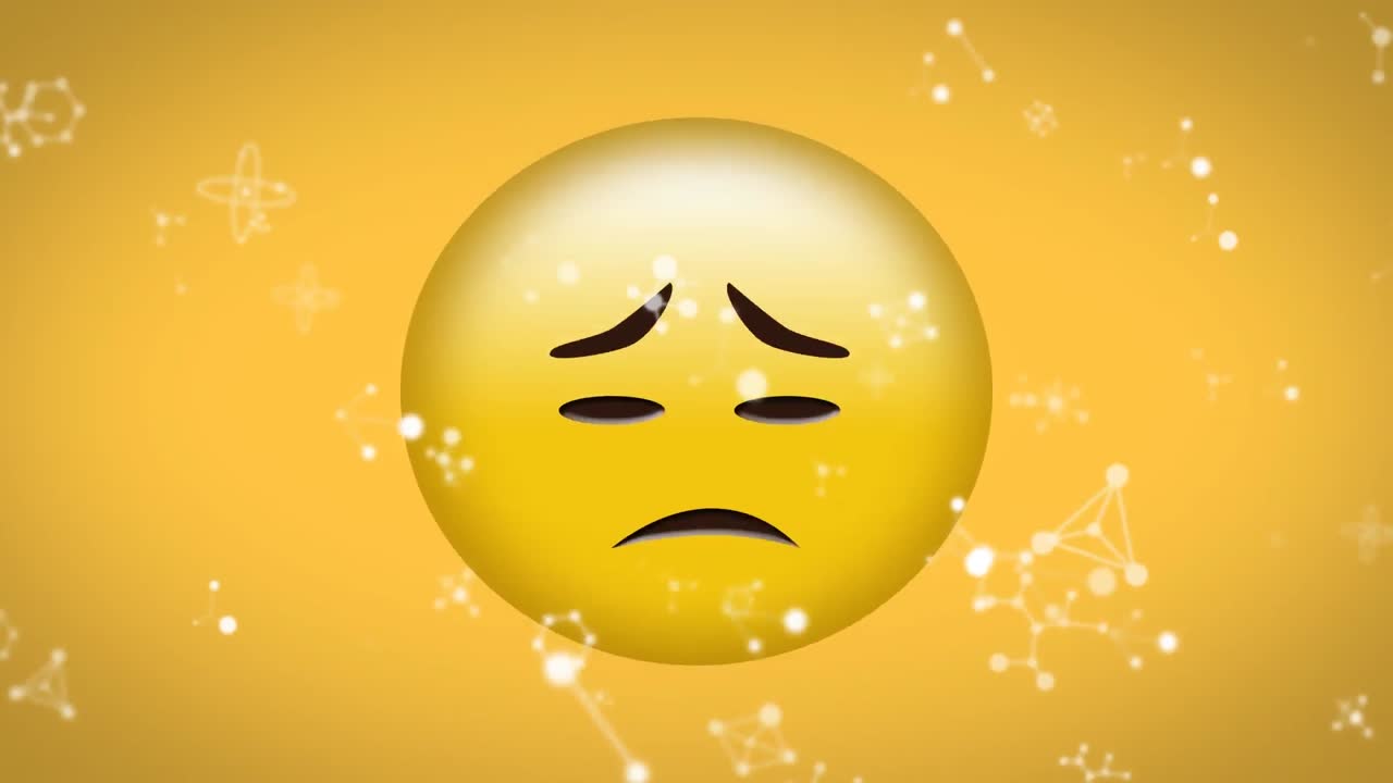 노란색 배경에 슬픈 얼굴 이모지 위에 떠다니는 분자 구조의 디지털 애니메이션