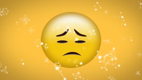 digital animation of molecular structures floating over sad face emoji on yellow background