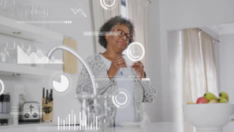 Animation-of-data-processing-over-senior-african-american-woman-drinking-coffee-in-kitchen