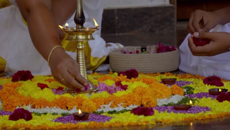 athapookkalam decorating for onam festival in kerala ,pookalam decorating kerala traditional family for onam celebration