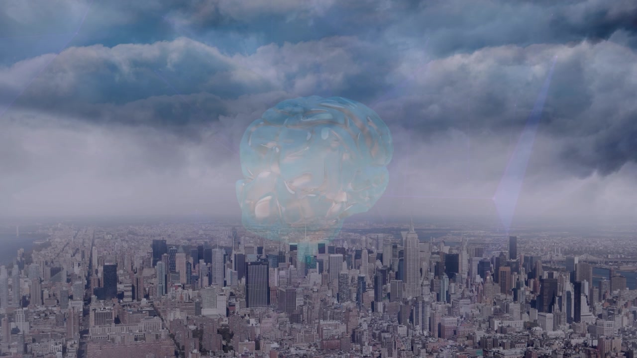 Human brain icon spinning against aerial view of cityscape