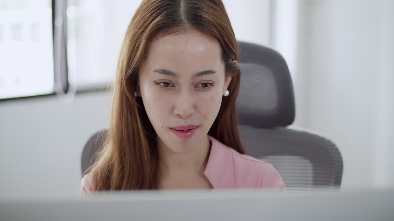 Happy Businesswoman Working on Computer