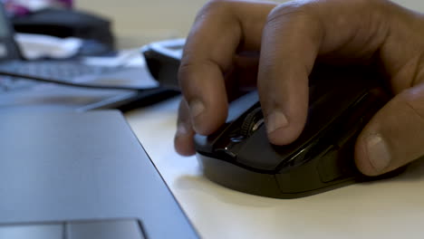 close up of ethnic minority male hand using computer mouse