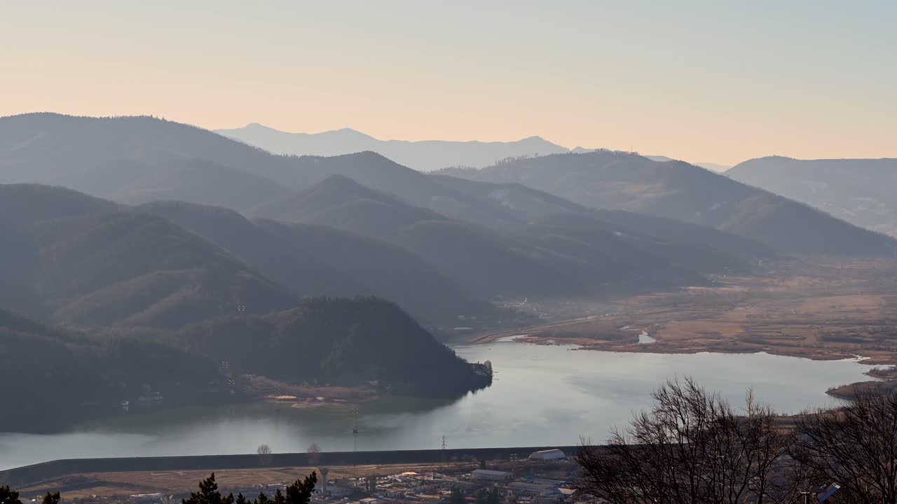 Aerial view of the Batca Doamnei Lake in Piatra Neamt, Romania, with the mountains on the background