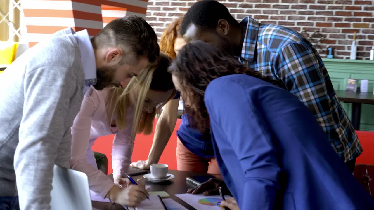 Team Brainstorming in Cafe