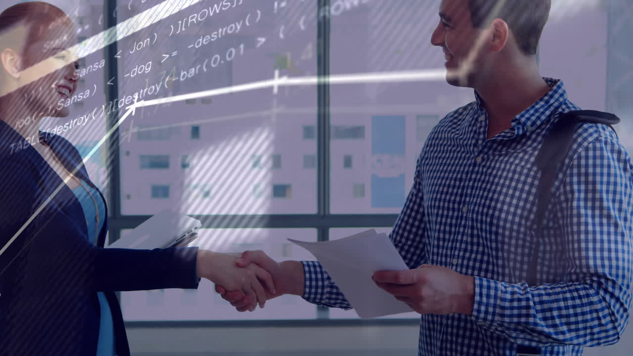 Two people shaking hands in office with coding animation overlay