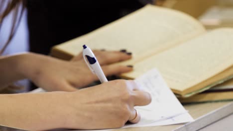 student taking notes in class