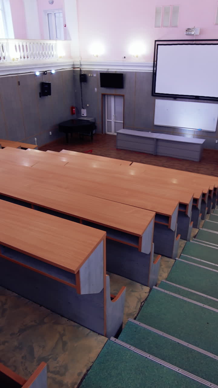 Conference lecture room with empty audience. Empty big modern education room. Vertical video