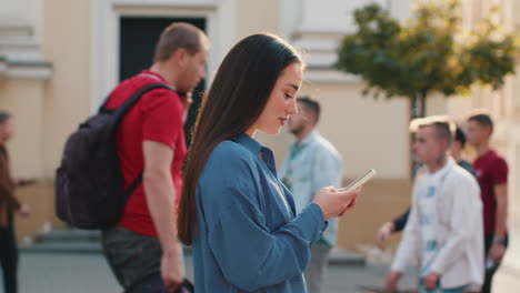 tourist traveler young woman using looking smartphone search a way on map in mobile navigator app