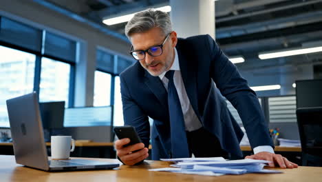 businessman using smartphone in office