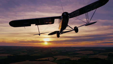 vintage biplane taking off at sunset over fields