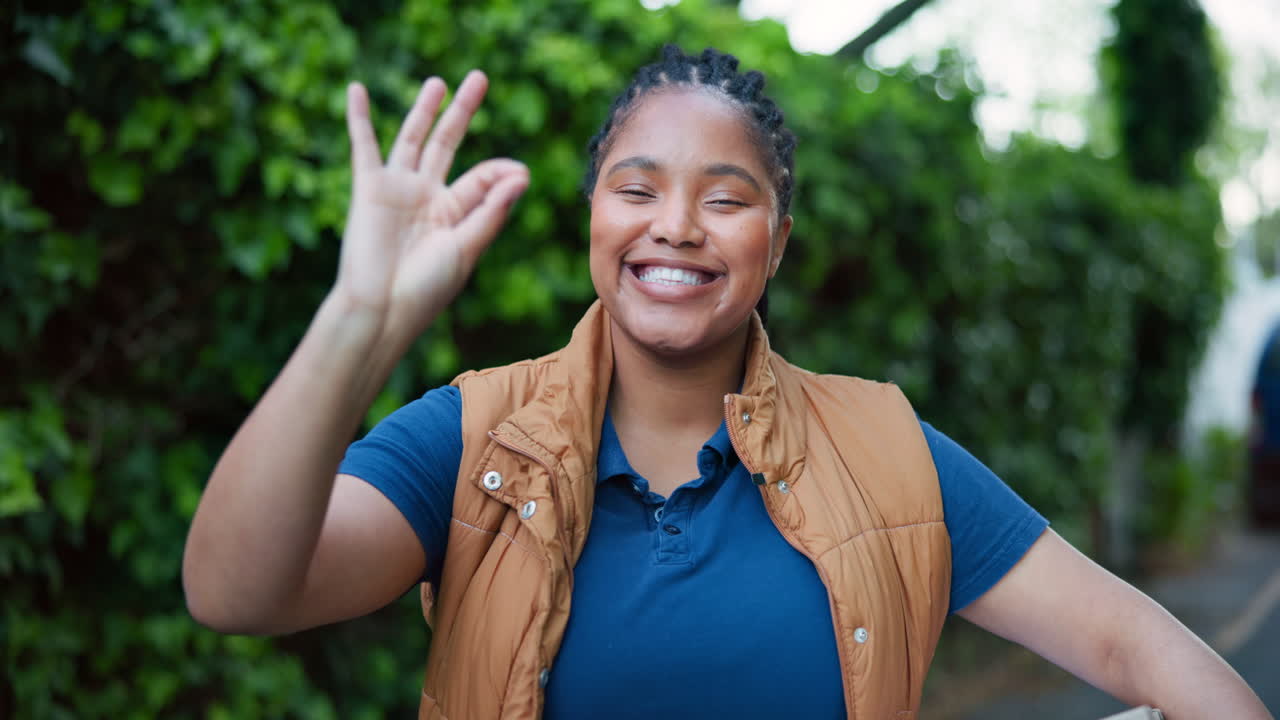 Happy Delivery Woman Making Okay Gesture with Package