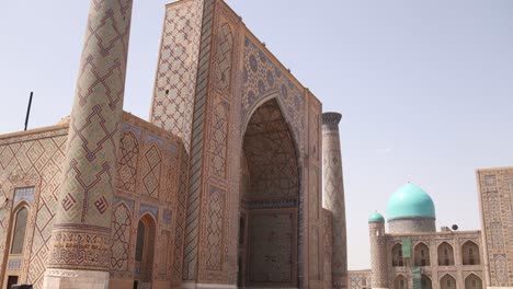 bright blue domed mosque and madrassas in registan square in samarkand, uzbekistan along the historic silk road