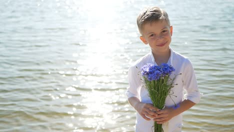 Boy Gives Flowers to Girl Happy Children Romantic Gift to Little Girl Brother and Sister Boy Gives Flowers to Girl Happy Children Romantic Gift to Little Girl Brother and Sister
