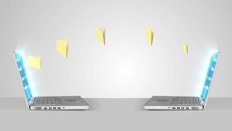 carpetas que se mueven de una computadora portátil a otra