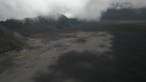 flyover of volcanic ash caldera at mt bromo in java, indonesia
