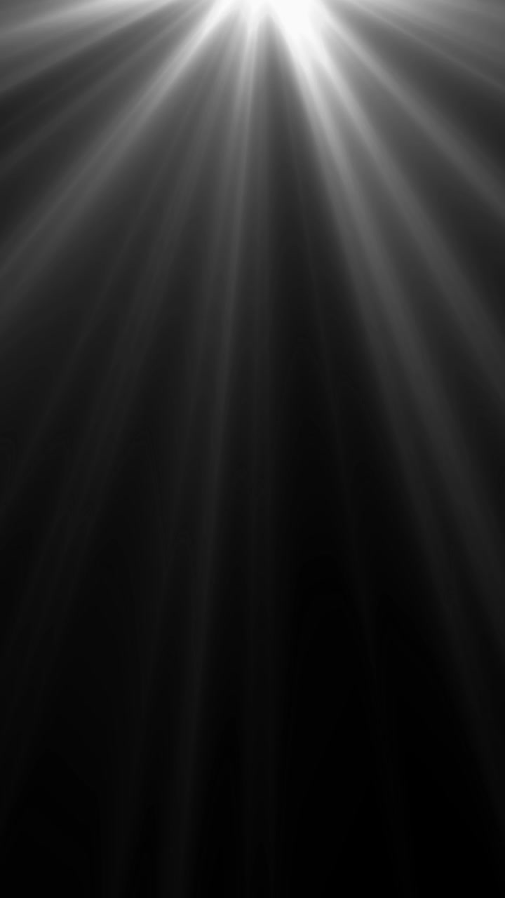 Cinematic white volumetric light rays shining down from above, creating an atmospheric god rays effect on a black background