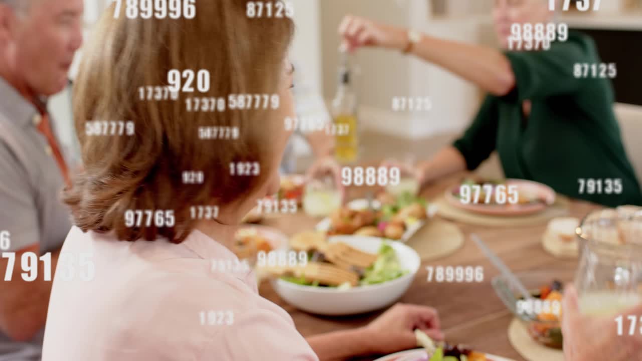 Talk sharing meal starting data overlays across faces, woman in pink toasting, camera pushing in